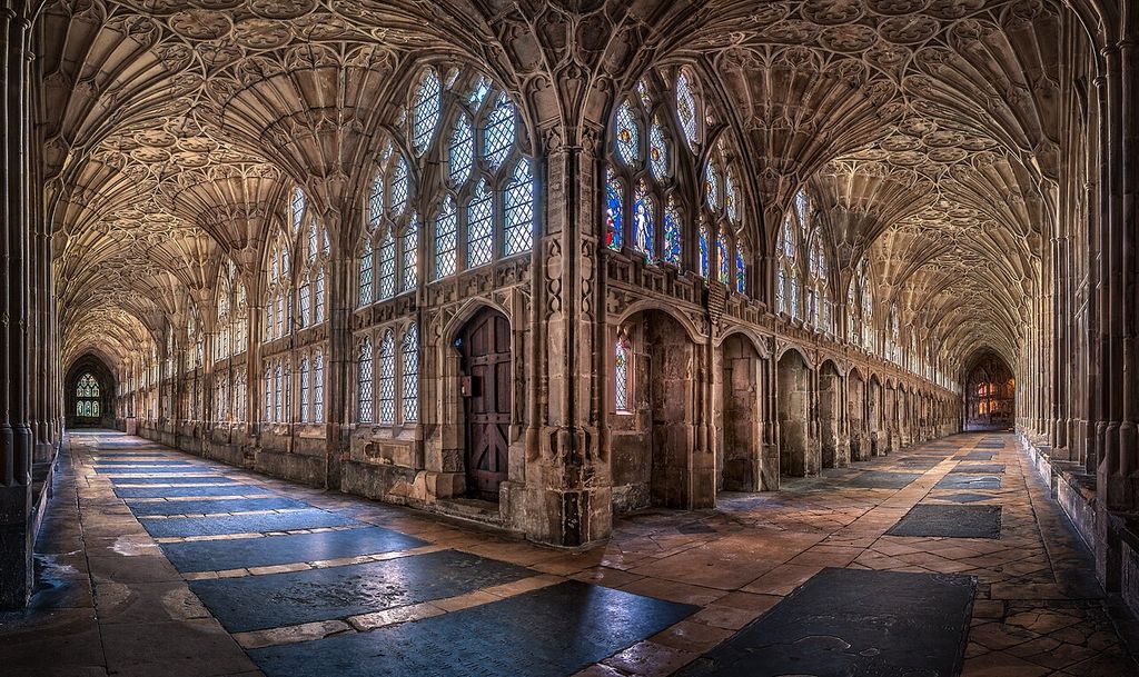 Stone ribs spread like fans above two adjoining cloister walks.