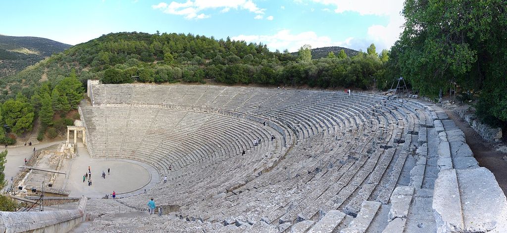 Curving tiers of stone seating surround the circular orchestra and open performance space.