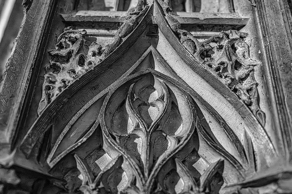Close-up view of decorative Gothic stonework inside Sainte-Cécile Cathedral in Albi, France, emphasizing textures, patterns, and craftsmanship.