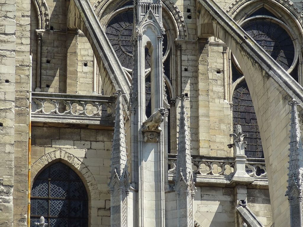 Some of the flying buttress roots and a gargoyle on the Notre Dame de Paris, created for more than just decoration, with a purpose to shed water away from the gothic architecture.