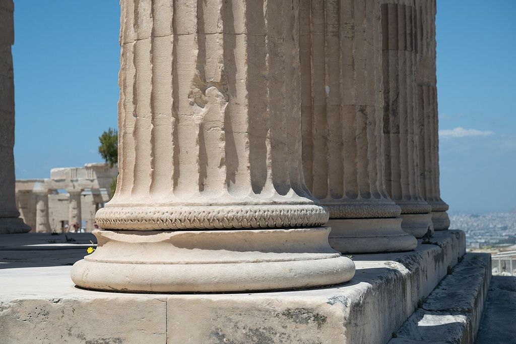 Close view of two carved Ionic bases and the lower fluted shafts of the Erechtheion's north porch.