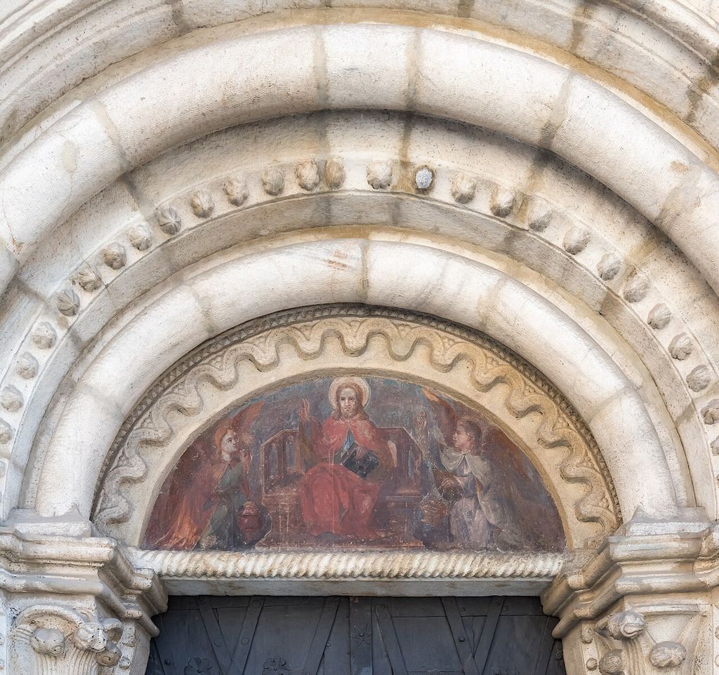 Romanesque tympanum over the western portal of the parish church Saint Marcus on Marcus Square, municipality Wolfsberg , district Wolfsberg, Carinthia , Austria , EU.