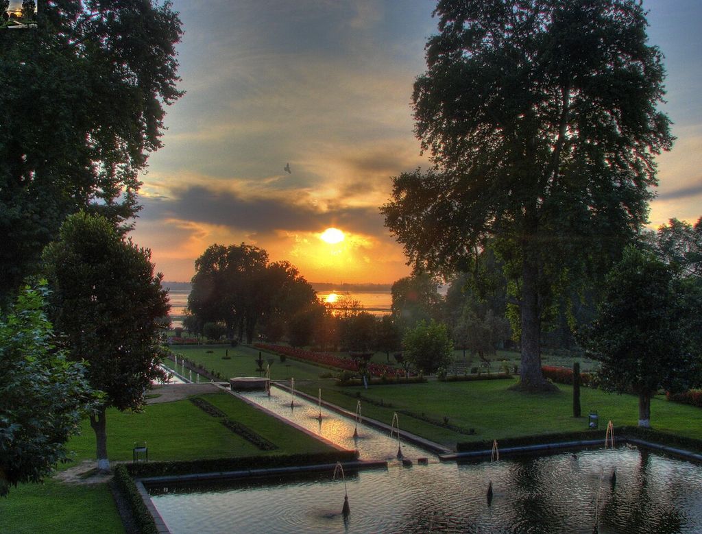 Trying an HDR shot of sunset over the terraces of the Nishat Bagh Mughal gardens gives it a surreal look, showing nishat Bagh Kashmir.