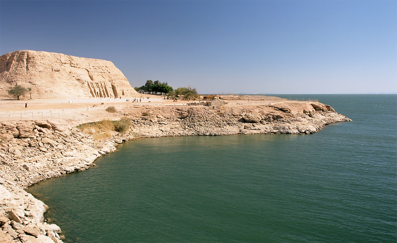 Lake Nasser bay and steep rocky shore below the Small Temple of Nefertari on its raised present site.