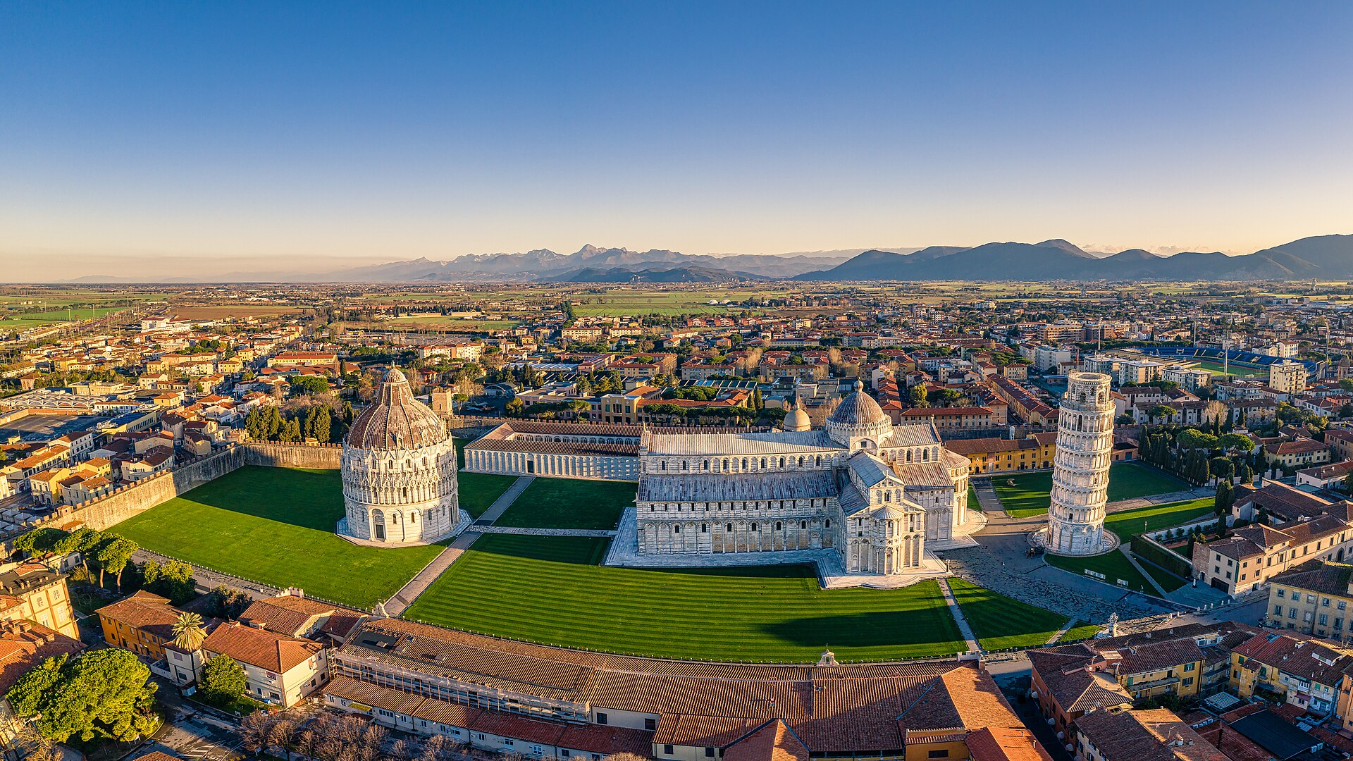 Aerial panorama of Pisa’s Piazza del Duomo showing the baptistery, cathedral, Leaning Tower and Camposanto.