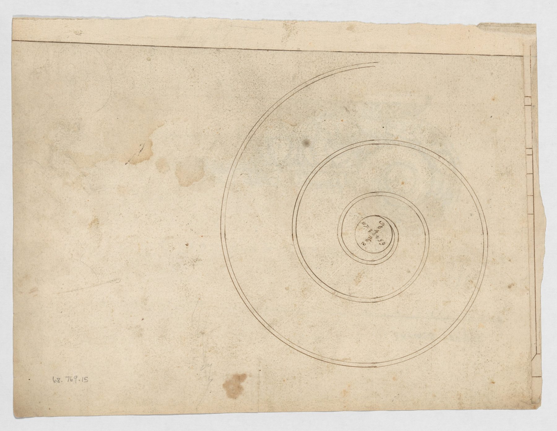 Pale sheet with a large incised Ionic-volute spiral and small construction points around its centre.