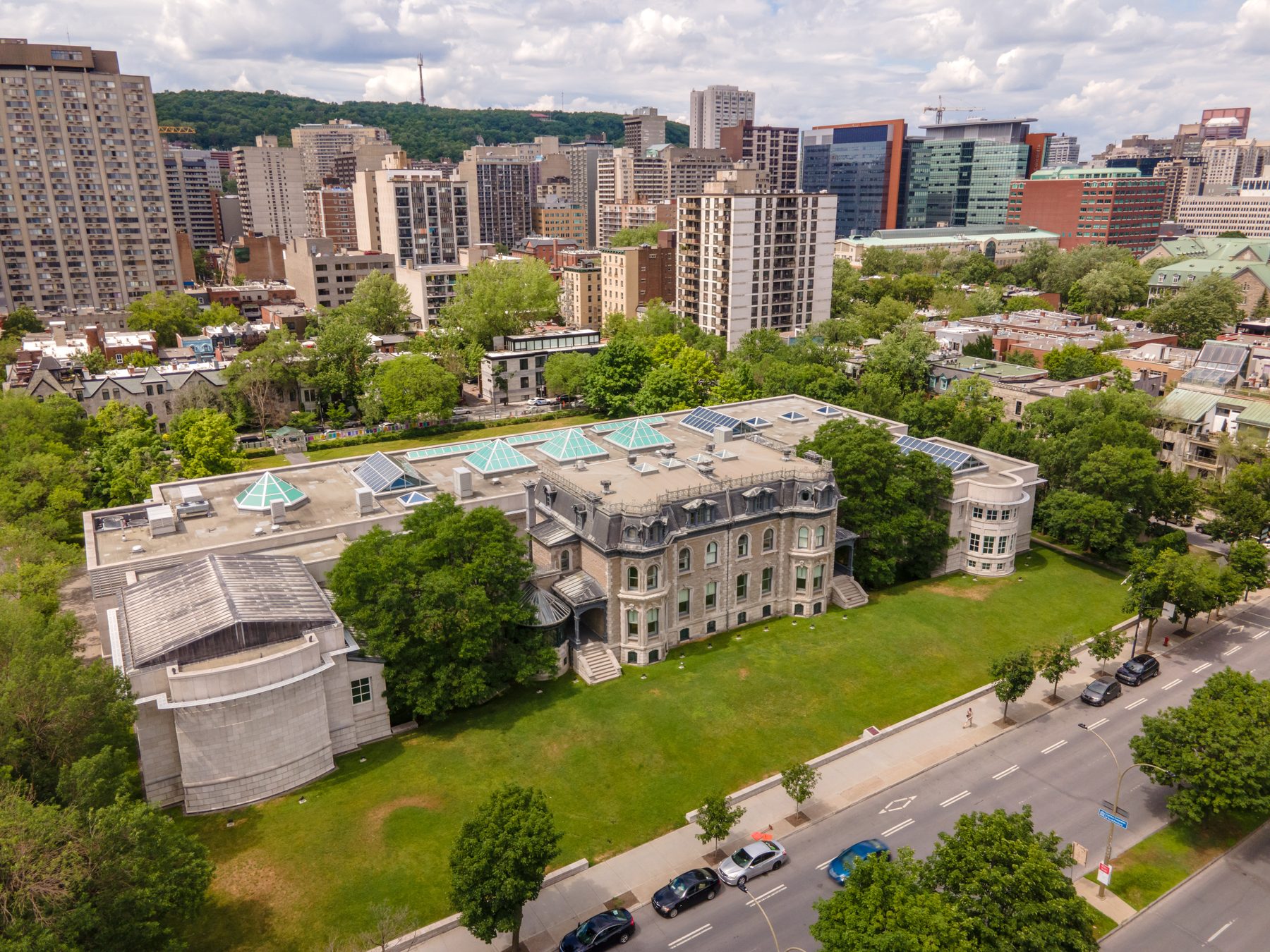 Aerial photograph of Canadian Centre for Architecture with conserved Shaughnessy House within the new building and city edge.