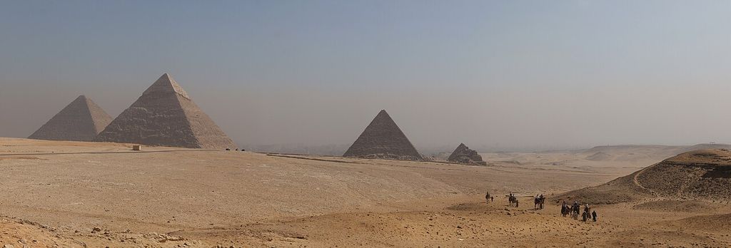 Large and smaller pyramids spread across the desert plateau at Giza.