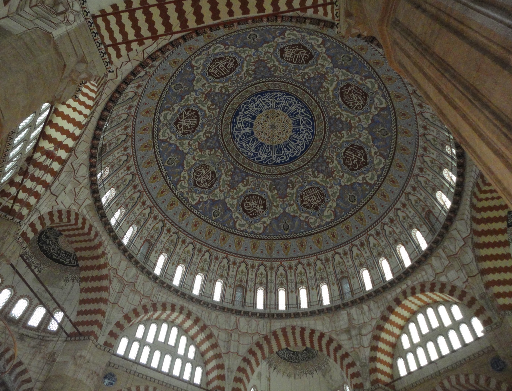 Photograph looking up at the main dome and neighbouring smaller vaults of Selimiye Mosque in Edirne.
