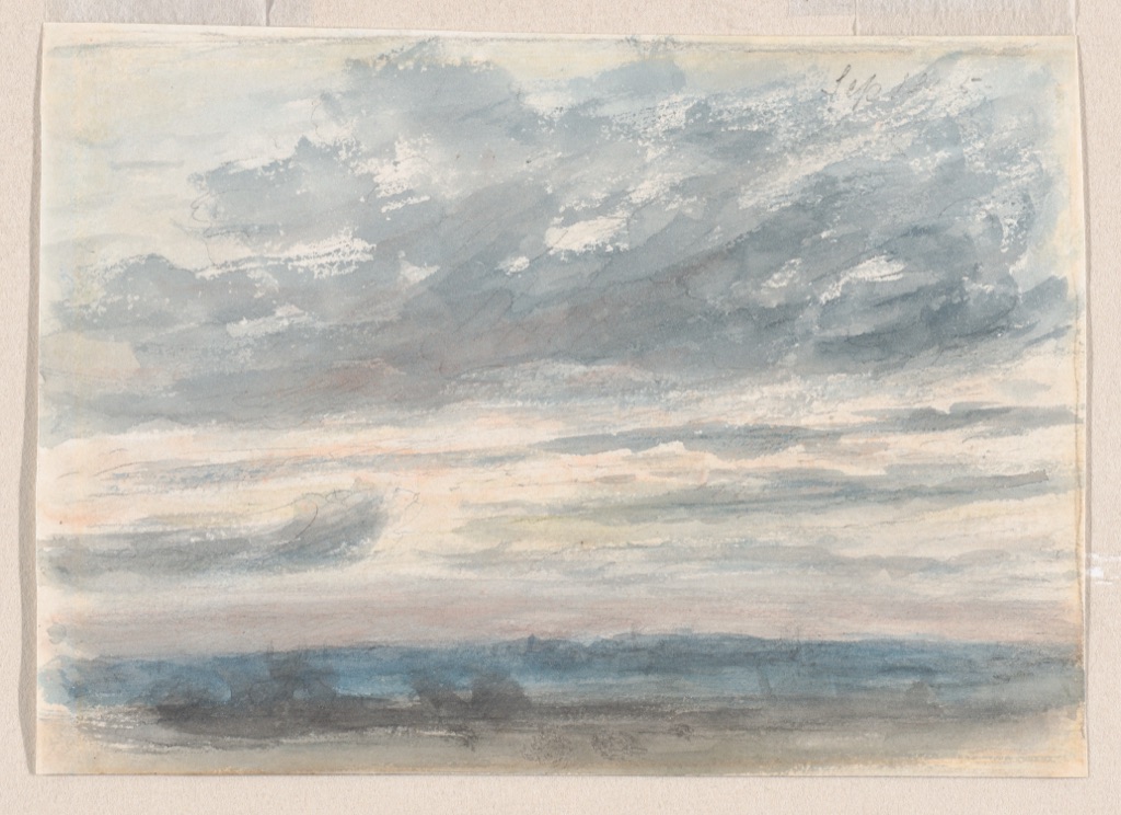 Loose blue and grey watercolour clouds above a pale horizon on a small sketchbook sheet.