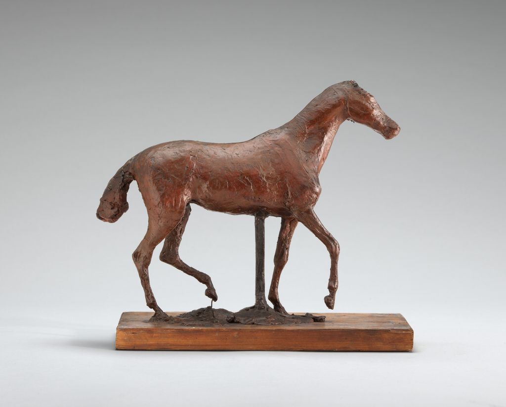 Dark original wax horse model walking with one foreleg lifted