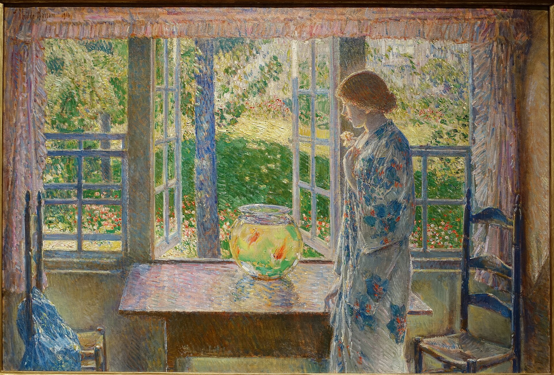 Hassam's Goldfish Window shows a woman standing beside a round goldfish bowl before open windows and a sunlit garden.