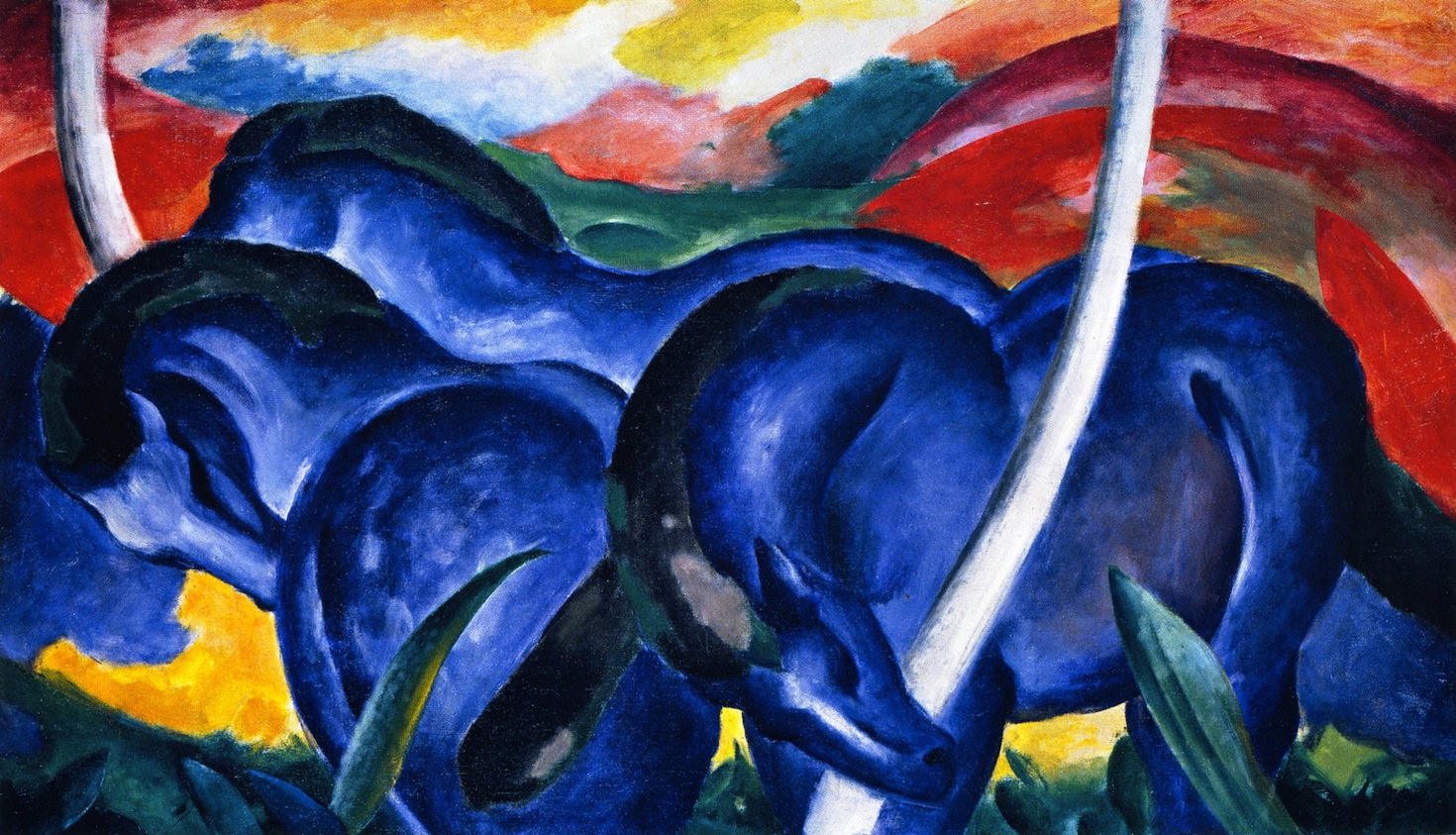 Three blue horses bend together across a red and green landscape in Franz Marc's The Large Blue Horses.