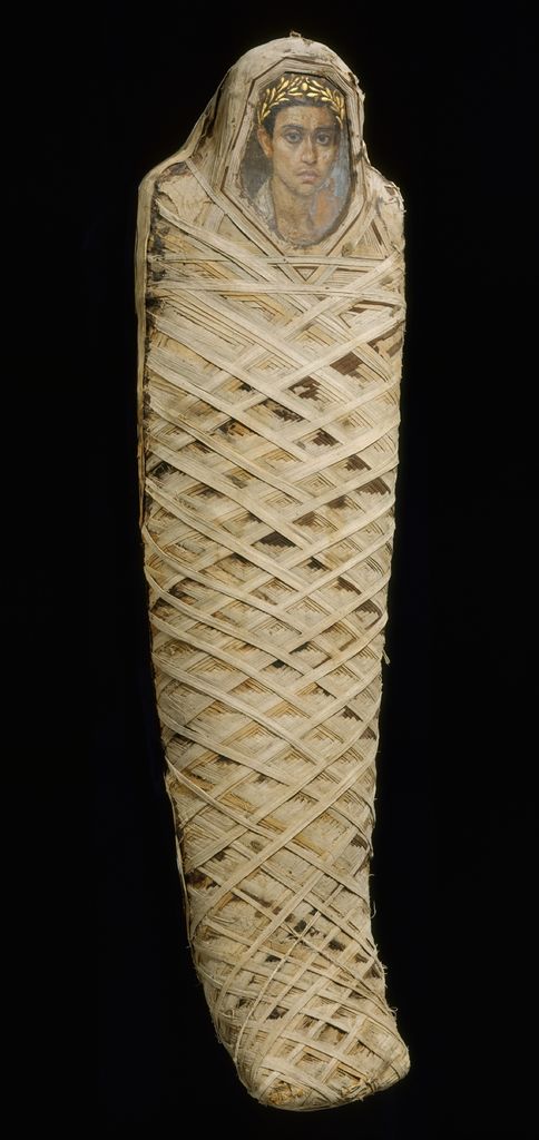 Roman Egyptian wrapped mummy with an encaustic portrait panel inserted over the face.