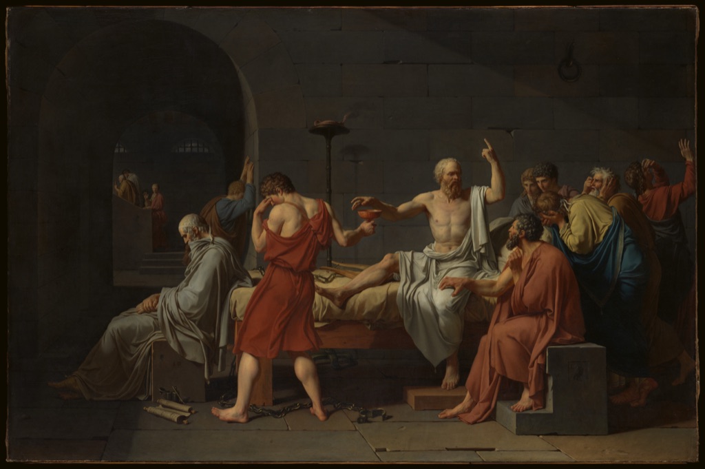 David's Death of Socrates shows the seated philosopher reaching for a cup while surrounding figures point, look and gesture across the complete painting.