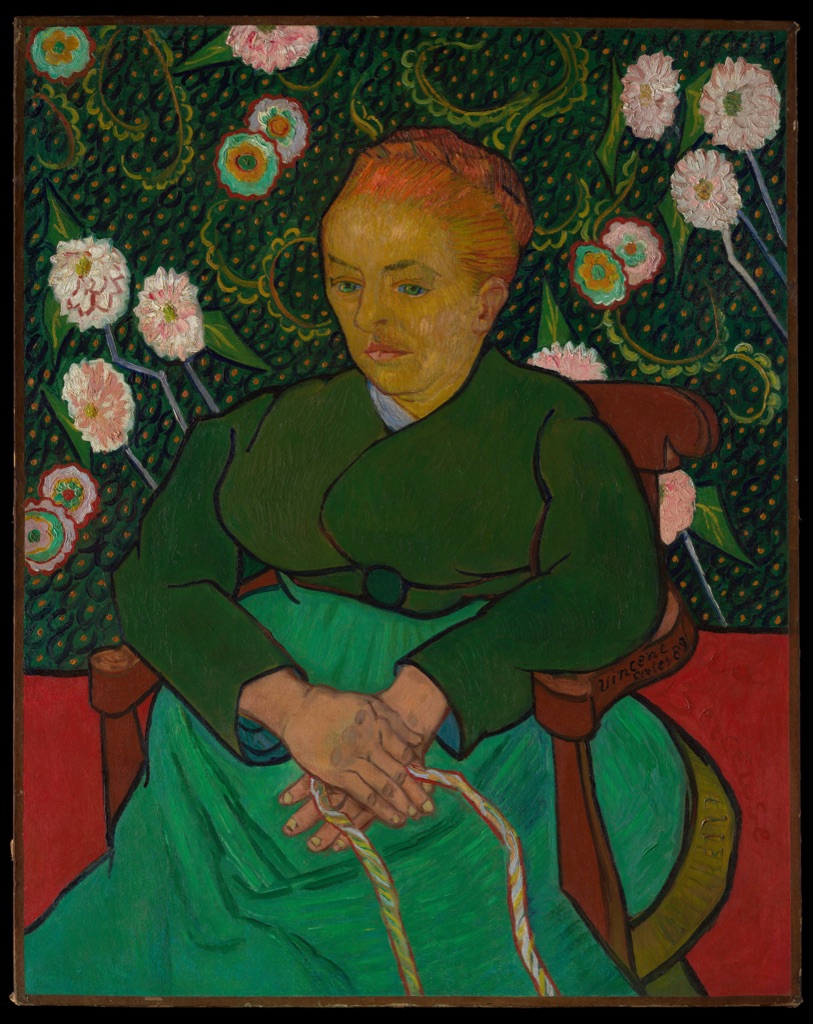 Van Gogh's Augustine Roulin sits in a green dress before dense green wallpaper patterned with curling leaves and pink flowers.