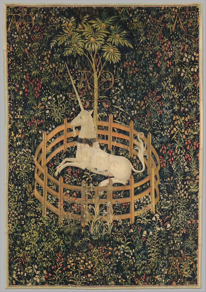 The Unicorn Rests in a Garden shows a white unicorn beneath a tree inside a low circular fence amid dense flowering plants.