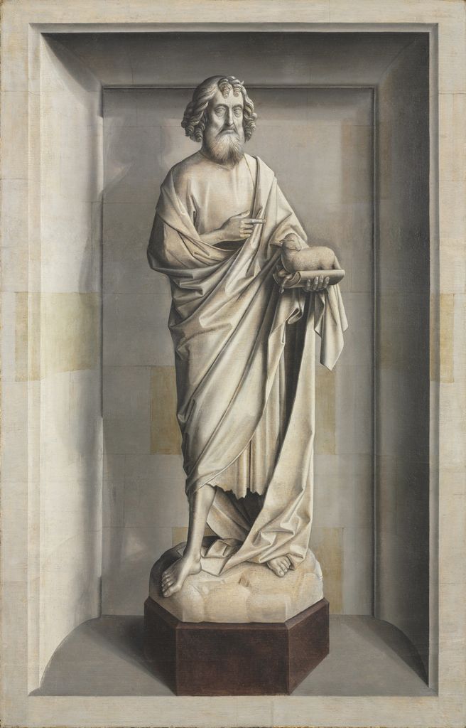 Grey-painted Saint John the Baptist and lamb posed like carved sculpture in a niche.