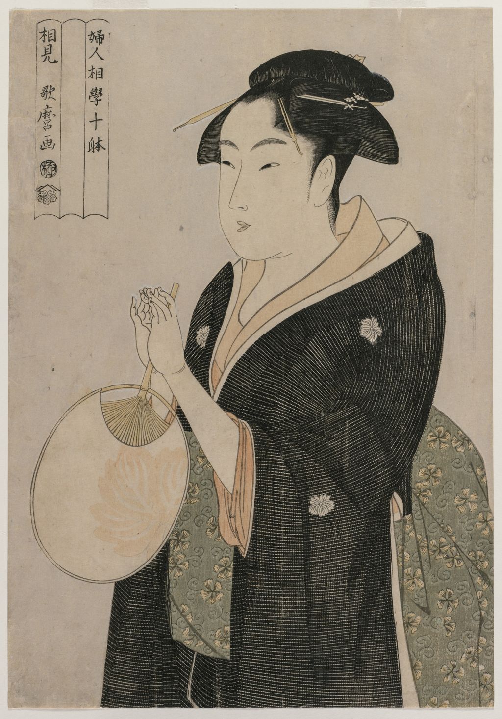 Woman holding a fan